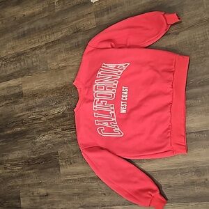 A pink sweater, size medium, pink